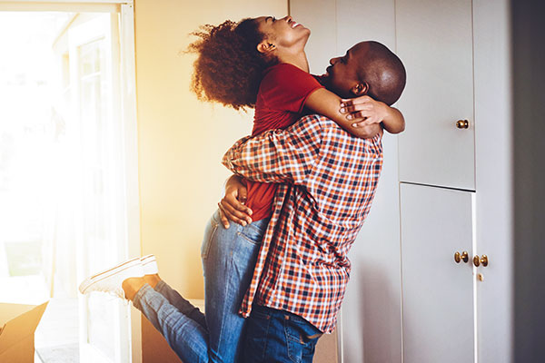 Exuberant couple after getting new home loan. 